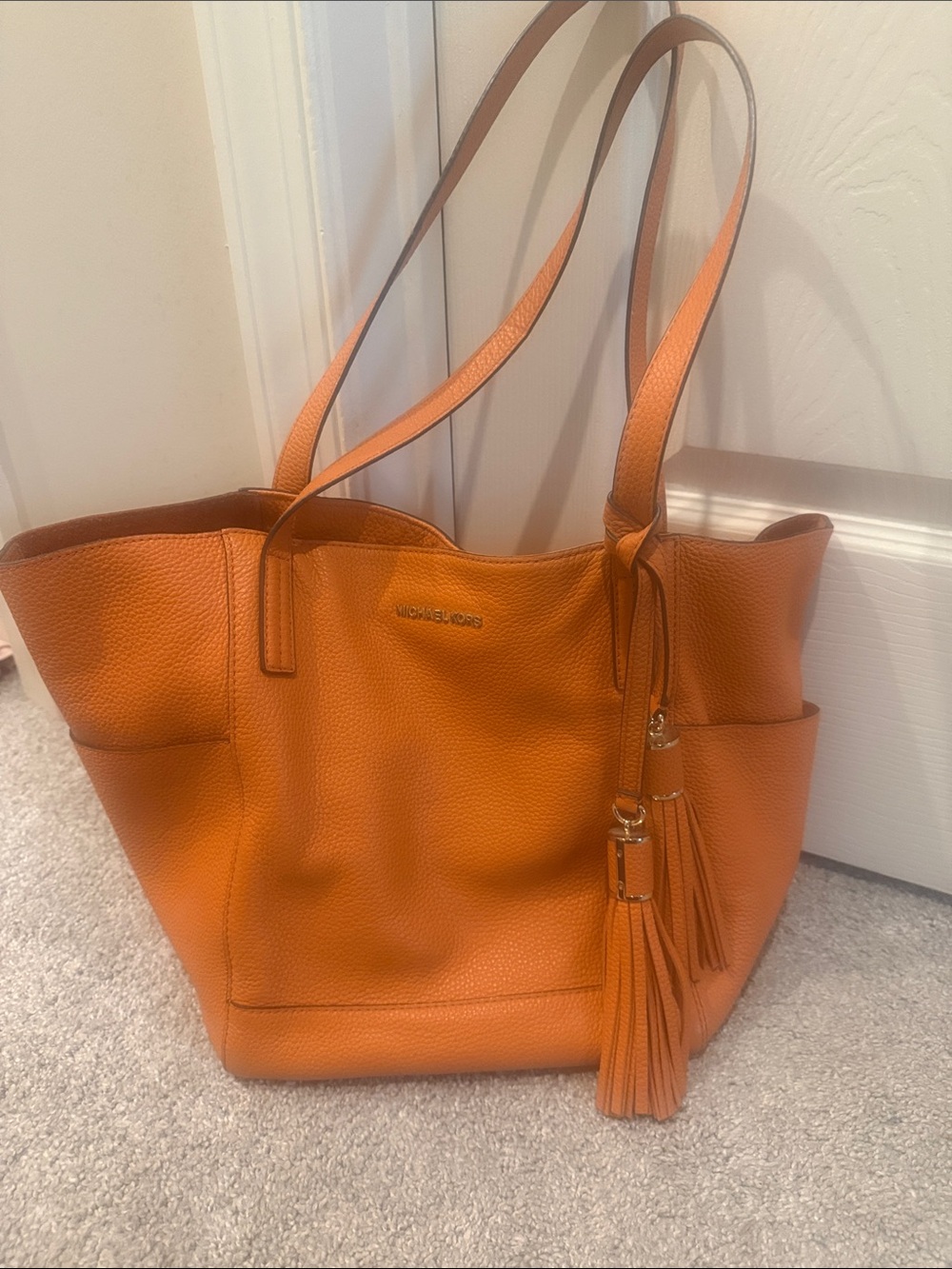 Michael Kors Orange Pebbled Leather Tote with Tassel Charm-never worn!
